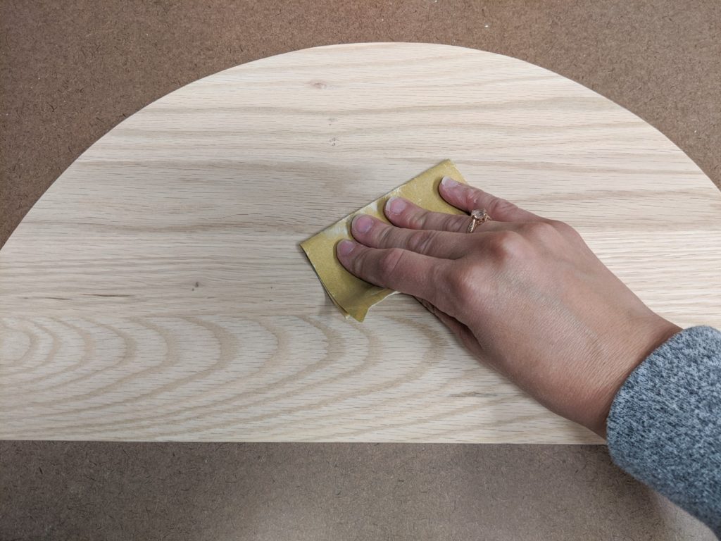 Sanding semicircles with 120 and then 220 grit sandpaper
