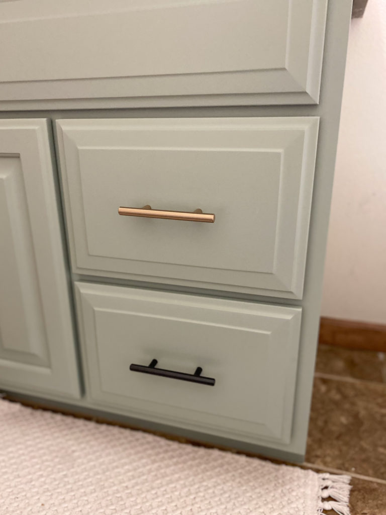 Beautifully painted bathroom cabinet without brush strokes in sage green