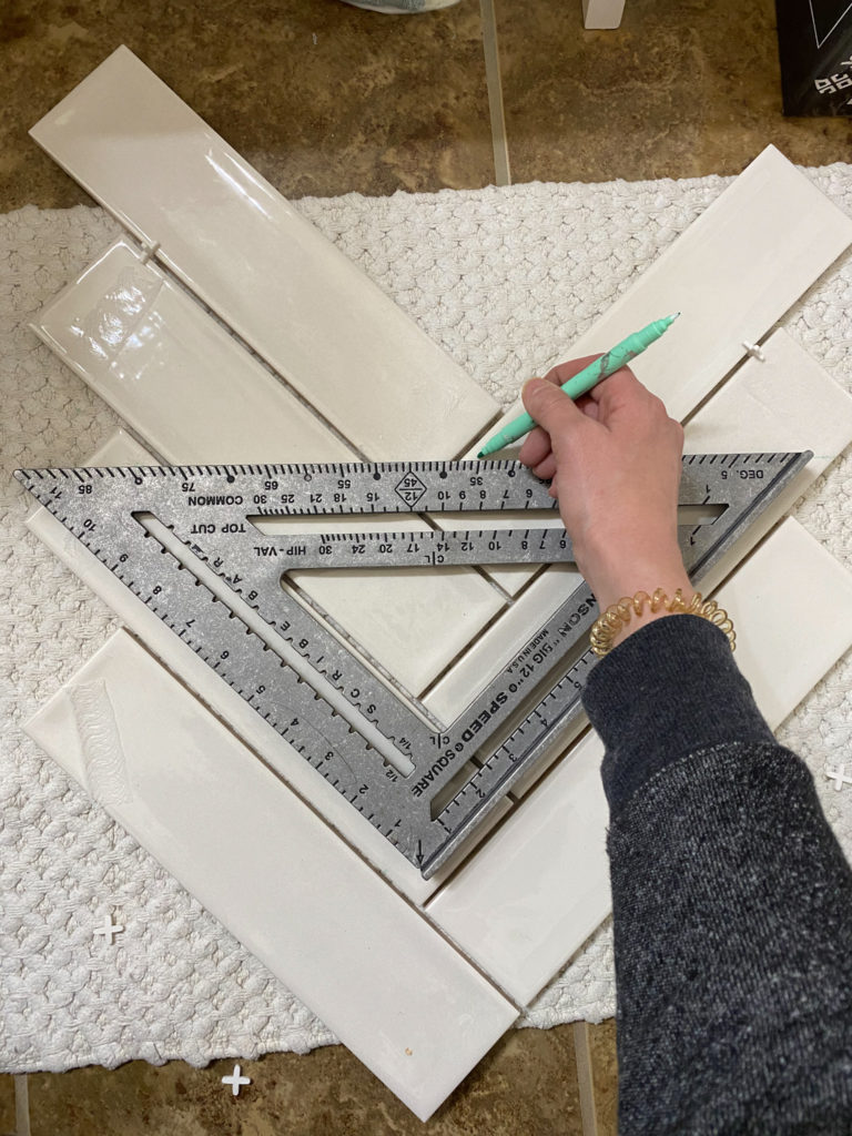 Marking tiles for cutting herringbone pattern