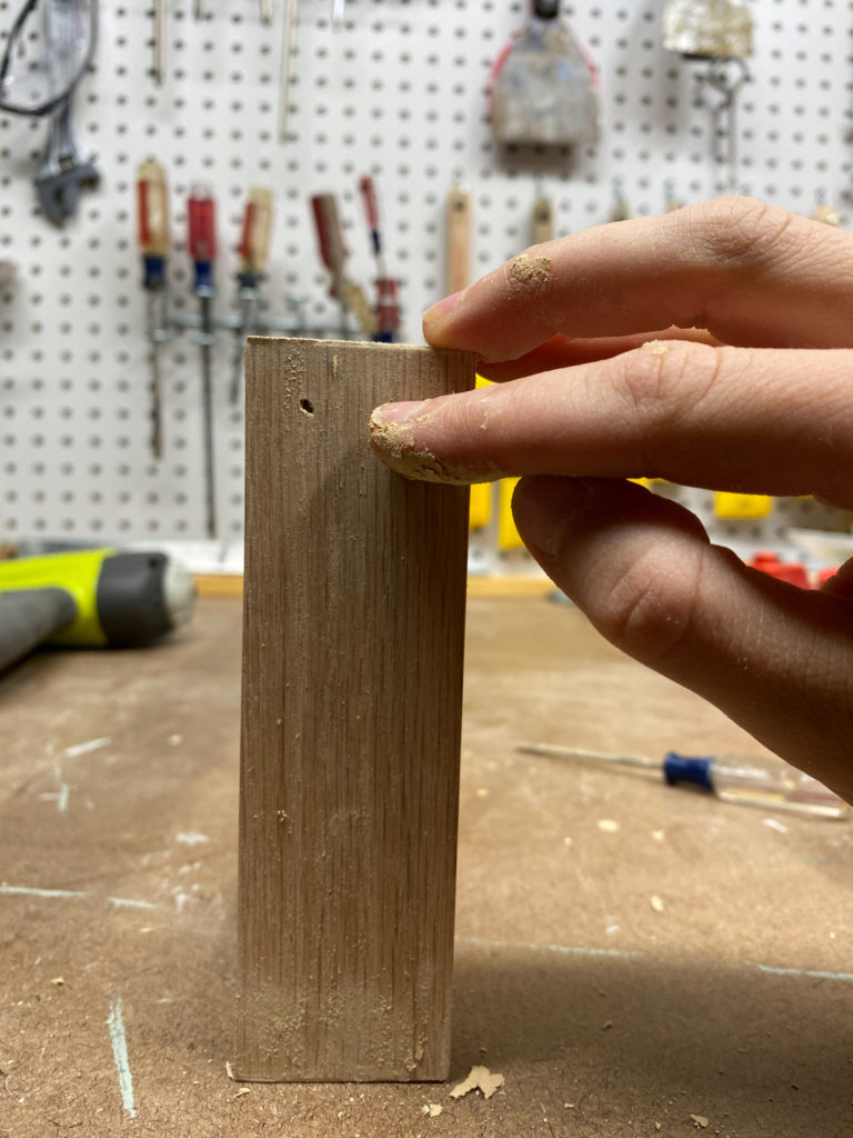 Filling nail holes with wood putty
