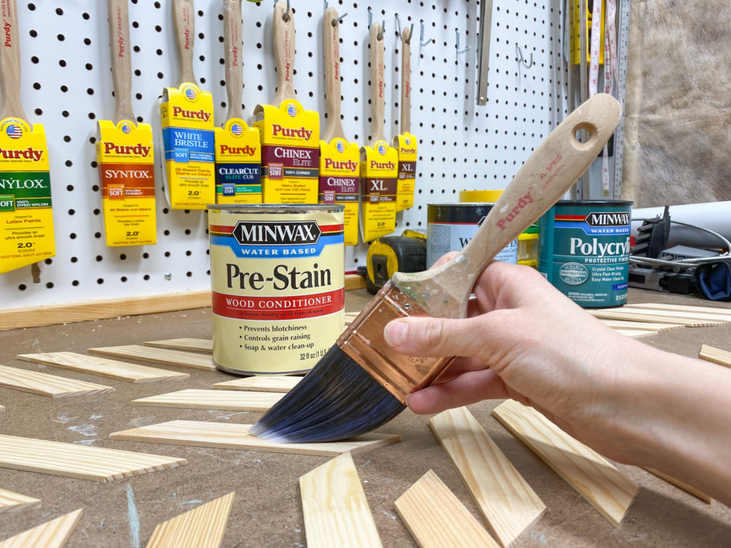 Applying Minwax Pre-Stain Wood Conditioner to paint sticks