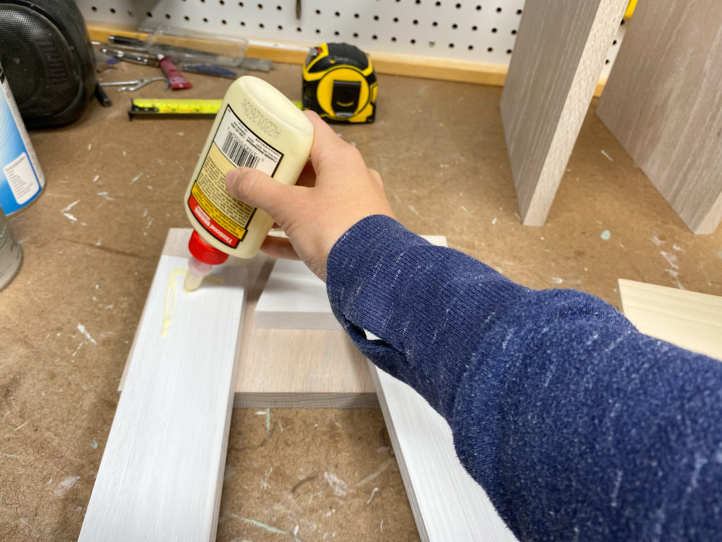 Assembling nightstand with wood glue and screws